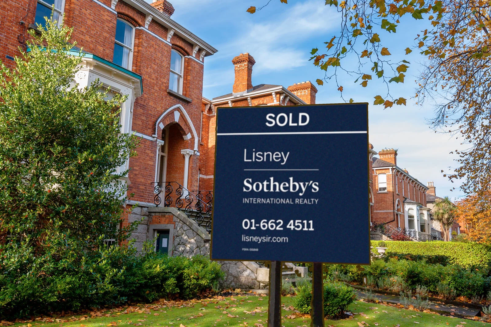 Dublin redbrick period houses behind an estate agent’s Sold sign